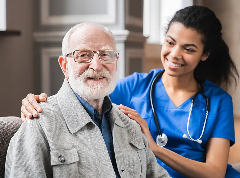 A nurse monitoring a patient’s blood sugar levels at home.